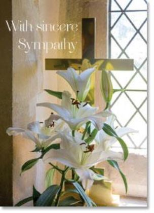 Picture of White lilies near cross
